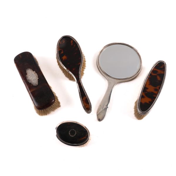 A GROUP OF FIVE SILVER MOUNTED TORTOISESHELL DRESSING TABLE WARES (5)
