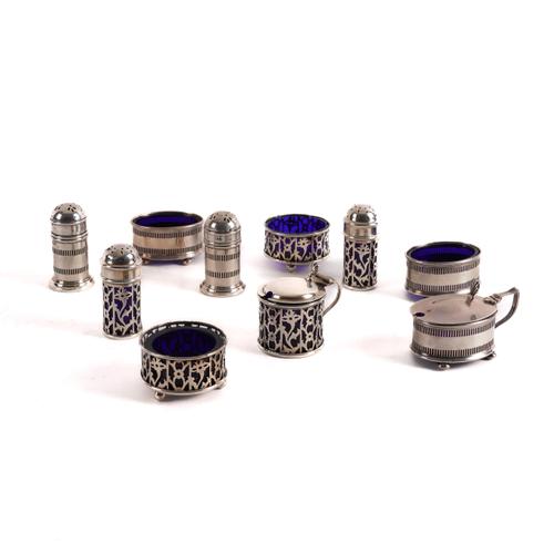 A SILVER FIVE PIECE CRUET SET AND A SILVER MATCHED FIVE PIECE CRUET SET (10)