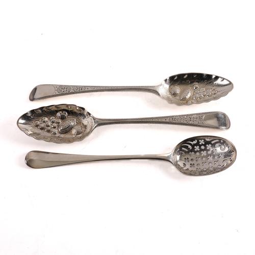 A PAIR OF SILVER FRUIT SERVING SPOONS AND ANOTHER SILVER SPOON (3)