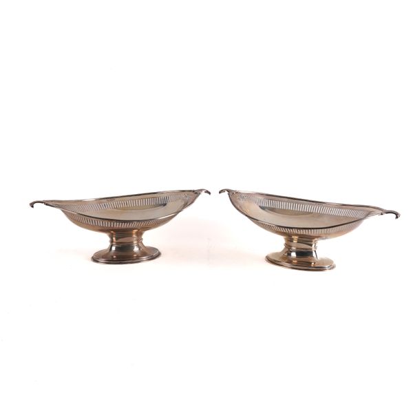 A PAIR OF SILVER TWIN HANDLED OVAL PEDESTAL DISHES (2)