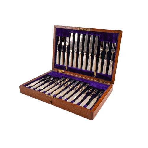 TWELVE PAIRS OF SILVER DESSERT OR FRUIT KNIVES AND FORKS