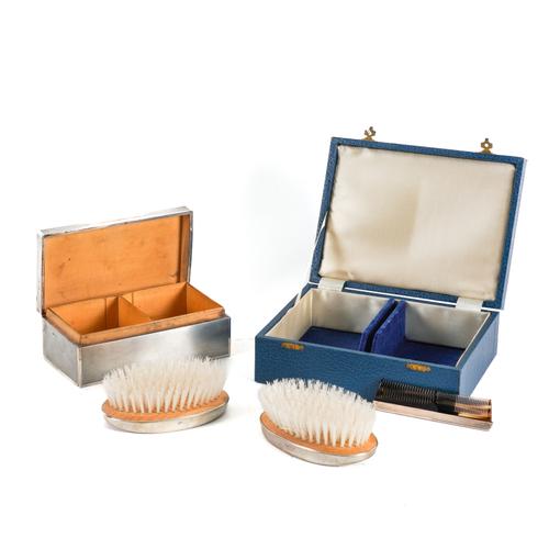 A SILVER MOUNTED THREE PIECE BRUSH AND COMB SET AND A SILVER CIGARETTE BOX (2)