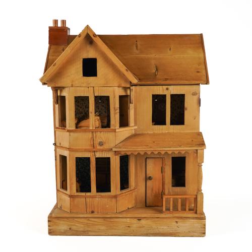 A PINE DOLL'S HOUSE MODELLED AS A VICTORIAN VILLA