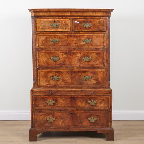 A GEORGE I FIGURED WALNUT CHEST ON CHEST