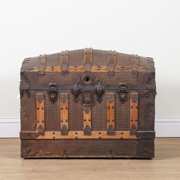 AN ART NOVEAU METAL BOUND AND MOUNTED DOMED STEAMER TRUNK