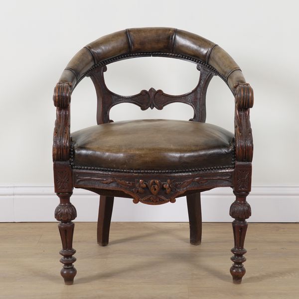 A VICTORIAN CARVED OAK FRAMED STUDDED LEATHER UPHOLSTERED TUB BACK DESK CHAIR