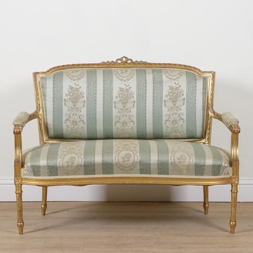 A LOUIS XVI STYLE GILT FRAMED TWO SEAT OPEN ARM SETTEE