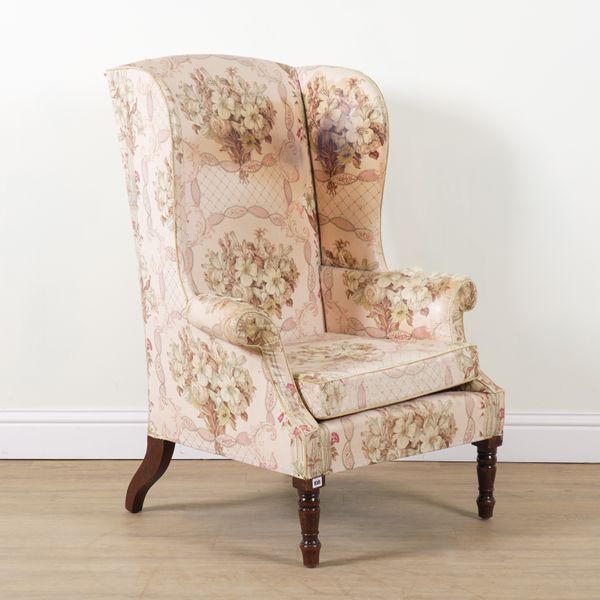 A GEORGE III STYLE WINGBACK ARMCHAIR