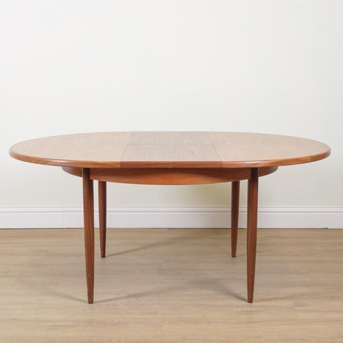 G-PLAN; A TEAK EXTENDING DINING TABLE