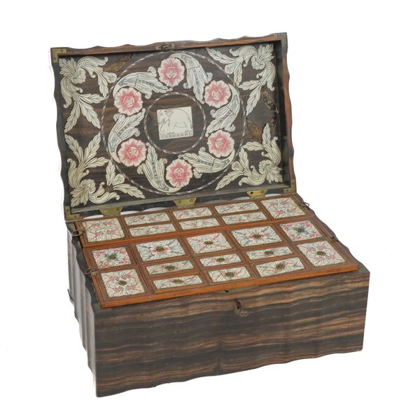 A 19TH CENTURY INDIAN BRASS BOUND COROMANDEL SHAPED RECTANGULAR LIFT TOP BOX