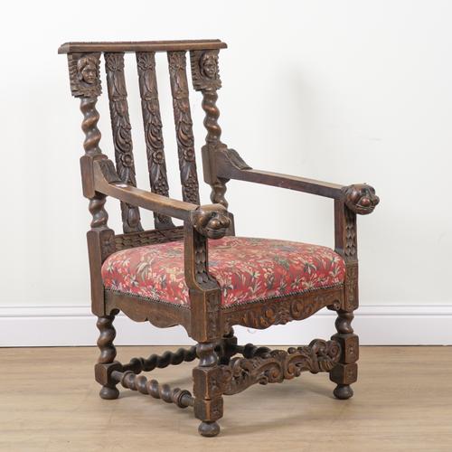AN OAK FRAMED OPEN ARMCHAIR