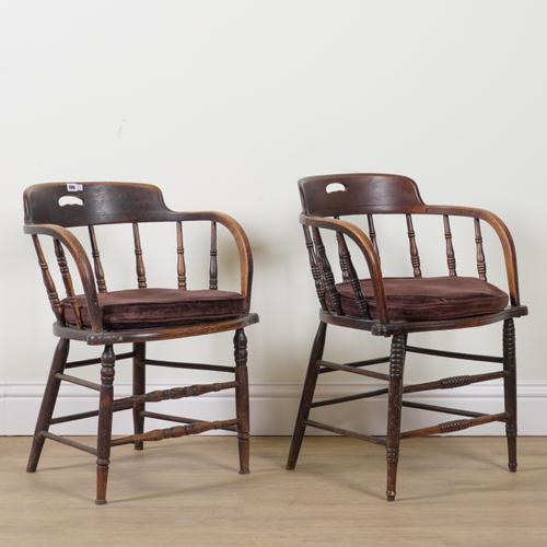 A NEAR PAIR OF EDWARDIAN OAK FRAMED TUB BACK DESK CHAIRS (2)