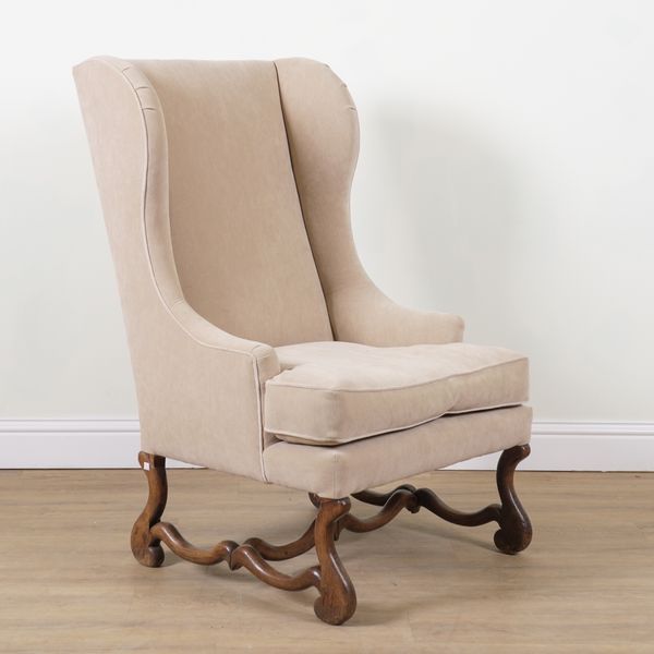 A 19TH CENTURY CONTINENTAL HIGH WINGBACK ARMCHAIR