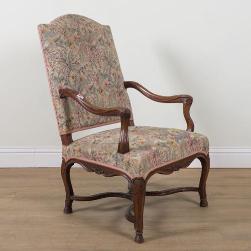 AN 18TH CENTURY FRENCH CARVED OAK ARCH BACK OPEN ARMCHAIR