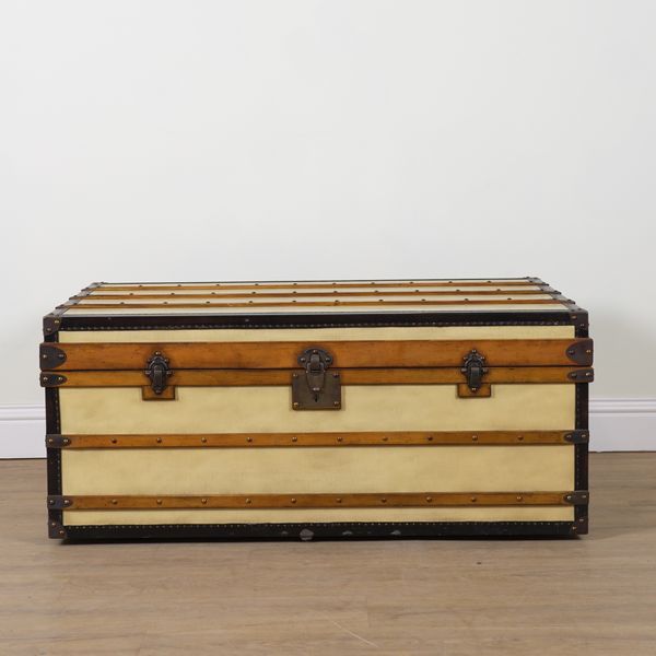 A CREAM FAUX LEATHER BOUND STEAMER TRUNK/COFFEE TABLE