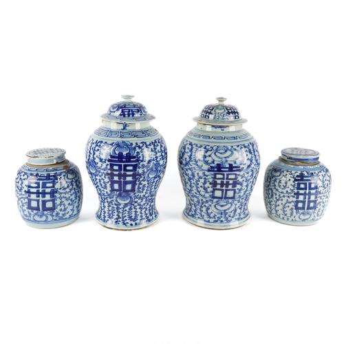 A MATCHED PAIR OF CHINESE BLUE AND WHITE PORCELAIN BALUSTER VASES WITH LIDS (4)