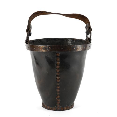 A VICTORIAN BRASS AND COPPER RIVETTED LEATHER FIREBUCKET