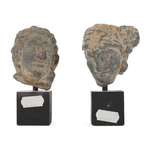 TWO CARVED STONE HEADS (2)