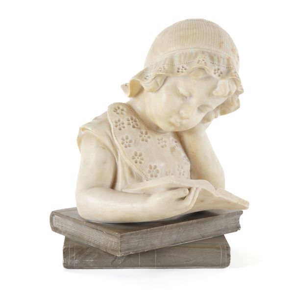 AN ITALIAN CARVED ALABASTER BUST OF A CHILD READING