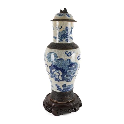 A CHINESE BLUE AND WHITE CRACKLE GLAZE BALUSTER VASE WITH COVER