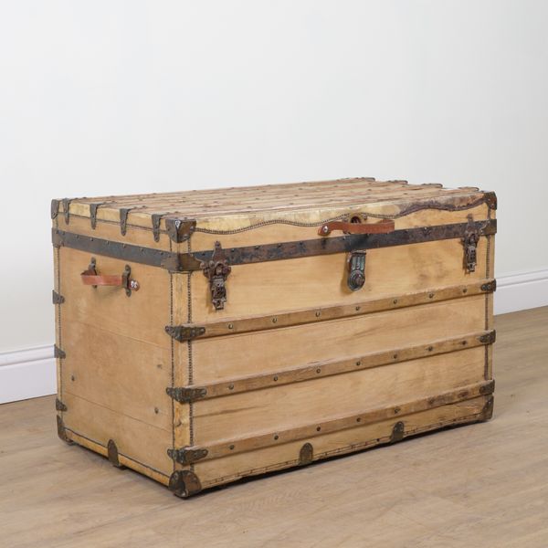 A LATE 19TH CENTURY PINE AND HIDE BOUND STEAMER TRUNK