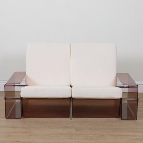 POSSIBLY MICHEL DUMAS; A SMOKED PERSPEX AND CHROME TUBULAR FRAMED TWO SEAT SOFA