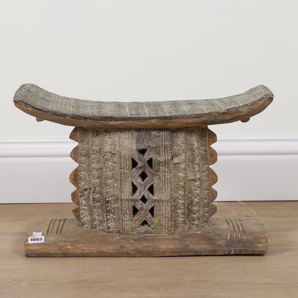 A GHANAIAN CARVED HARDWOOD ASHANTI STOOL