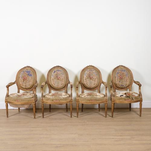 A SET OF FOUR LOUIS XVI STYLE GILT FRAMED OPEN ARMCHAIRS (4)