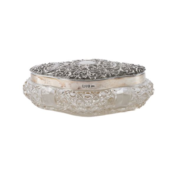A SILVER LIDDED GLASS DRESSING TABLE BOX