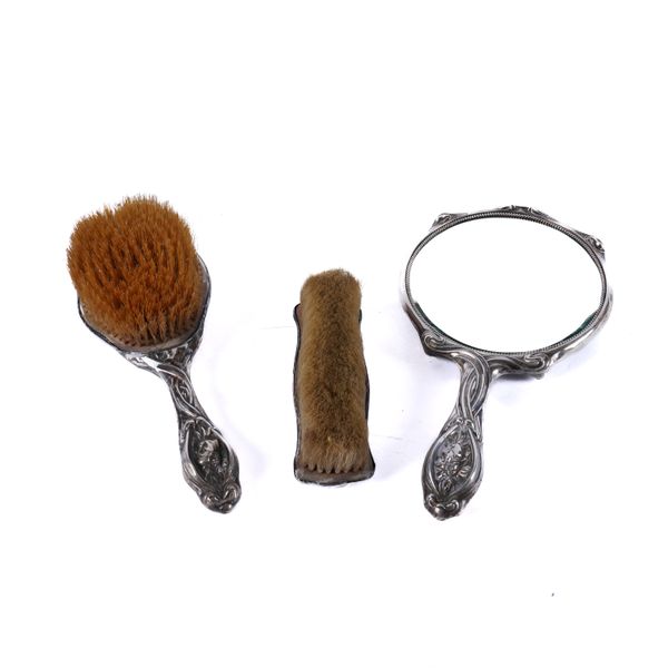 A SILVER MOUNTED THREE PIECE DRESSING SET