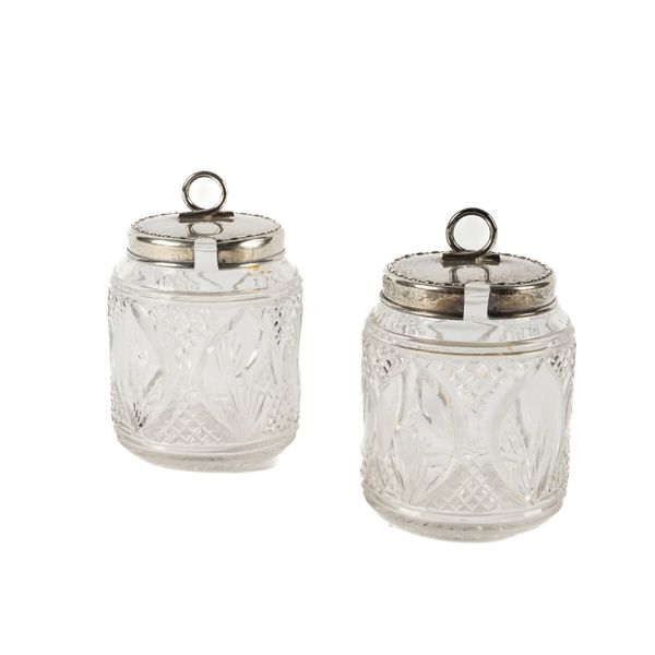 A PAIR OF SILVER LIDDED FACETED GLASS PRESERVE JARS (2)