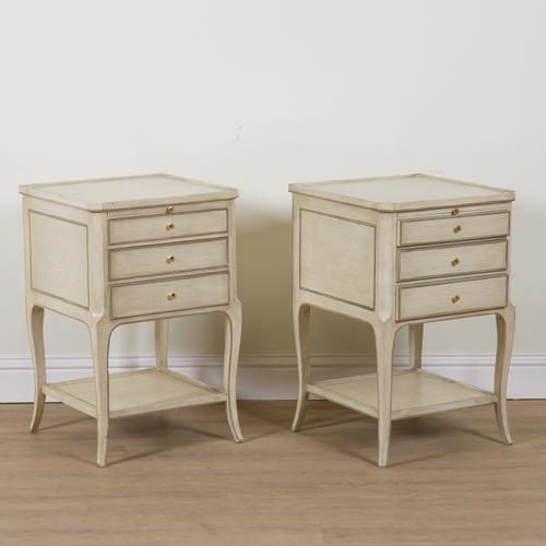 A PAIR OF CREAM PAINTED AND GREY HIGHLIGHTED SQUARE TWO TIER BEDSIDE TABLES (2)