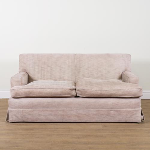 A MODERN PATTERN CREAM UPHOLSTERED TWO SEAT SOFA