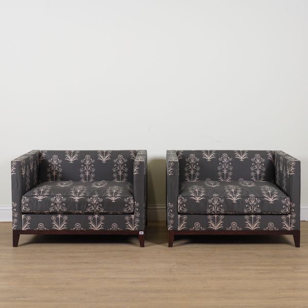CHRISTIAN LIAIGRE; A PAIR OF FLORAL AND CHARCOAL UPHOLSTERED SQUARE BACK ARMCHAIRS (2)
