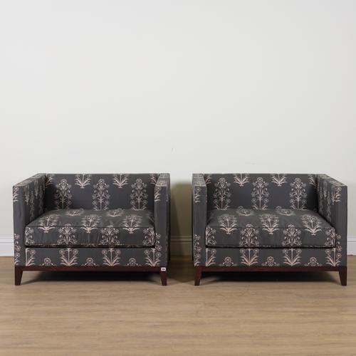CHRISTIAN LIAIGRE; A PAIR OF FLORAL AND CHARCOAL UPHOLSTERED SQUARE BACK ARMCHAIRS (2)