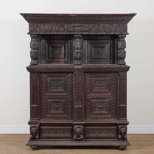 A 17TH CENTURY AND LATER CONTINENTAL EXTENSIVELY CARVED OAK COURT CUPBOARD