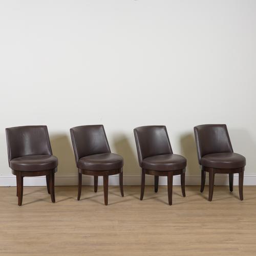 PHILLIPEE HUREL; A SET OF FOUR BROWN LEATHER UPHOLSTERED TUB BACK OFFICE CHAIRS (4)