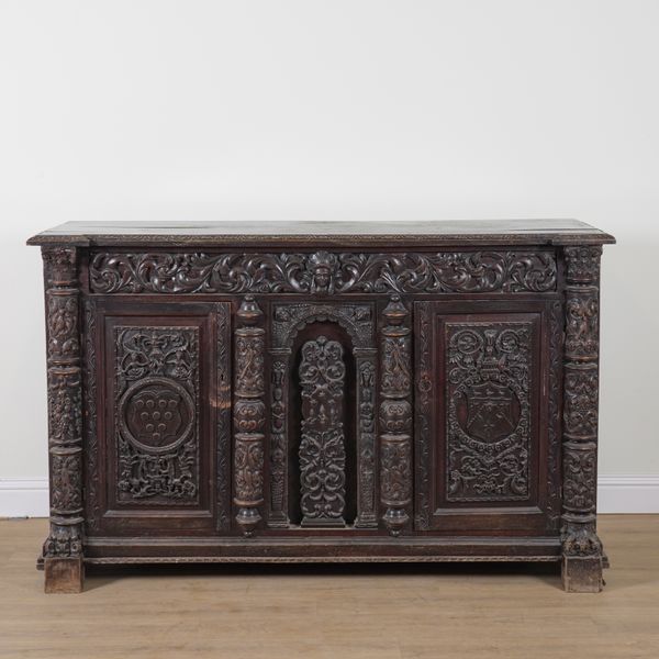 A 19TH CENTURY CONTINENTAL EXTENSIVELY CARVED OAK SIDE CABINET