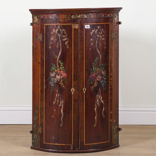 A MID 18TH CENTURY MAHOGANY BOWFRONT HANGING CORNER CUPBOARD