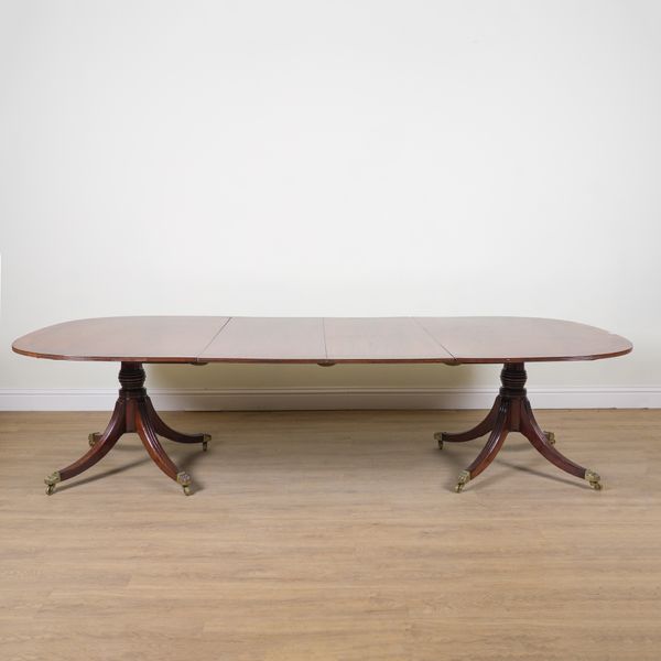 A GEORGE III AND LATER INLAID MAHOGANY D-END EXTENDING DINING TABLE