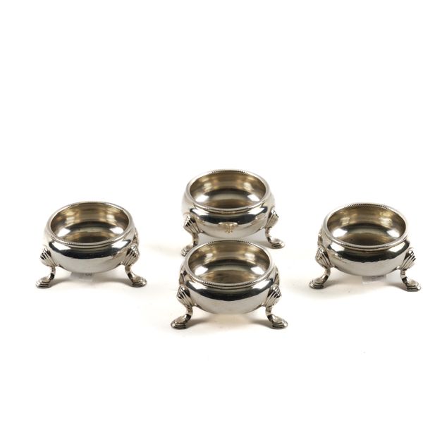A SET OF FOUR GEORGE III SILVER CIRCULAR SALTS (4)