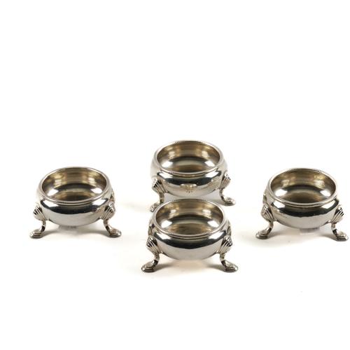 A SET OF FOUR GEORGE III SILVER CIRCULAR SALTS (4)