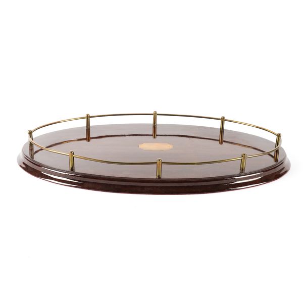 A MAHOGANY OVAL TRAY WITH BRASS GALLERY