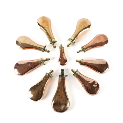 A GROUP OF TEN BRASS AND COPPER POWDER FLASKS  (10)