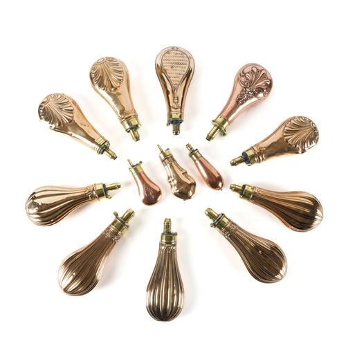 A GROUP OF FIFTEEN COPPER AND BRASS GUN POWDER FLASKS