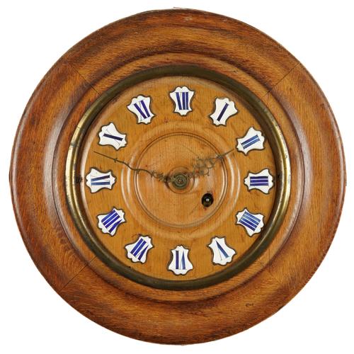 A VICTORIAN CIRCULAR OAK CASED WALL CLOCK
