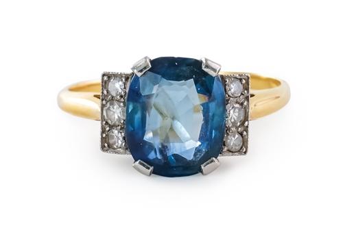 A SAPPHIRE AND DIAMOND RING