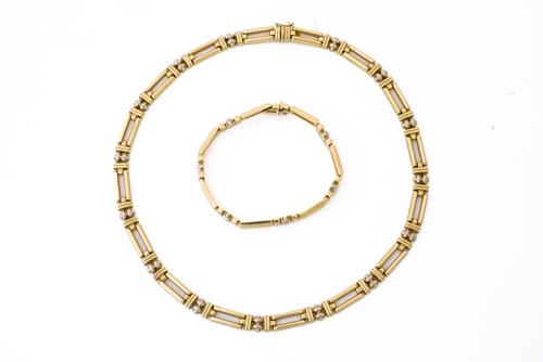 A MATCHING 9CT NECKLACE AND BRACELET