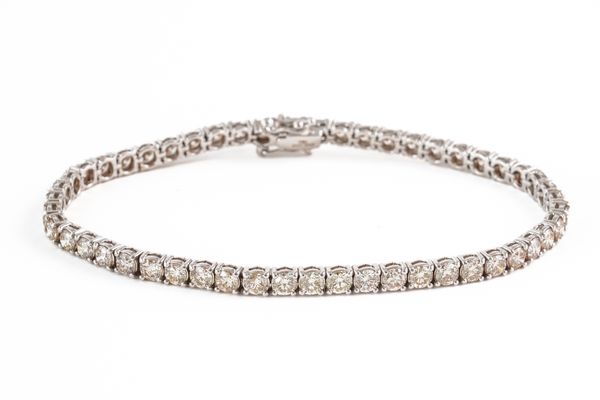 A DIAMOND LINE BRACELET, BOXED (3)