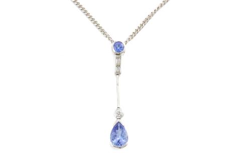 A TANZANITE AND DIAMOND PENDANT NECKLACE, BOXED